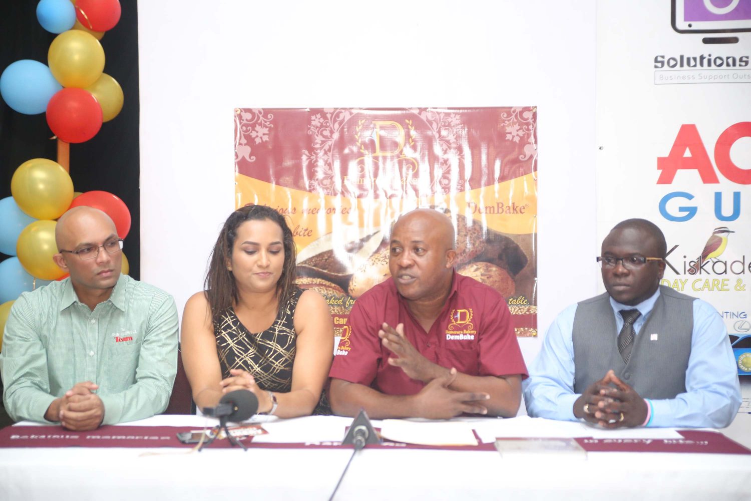 Managing Director of Demerara Bakery Kenneth Scrubb (second, from right) with founder of ActionCOACH Guyana Vishnu Doerga (first left) and others at Friday’s rebranding event. 