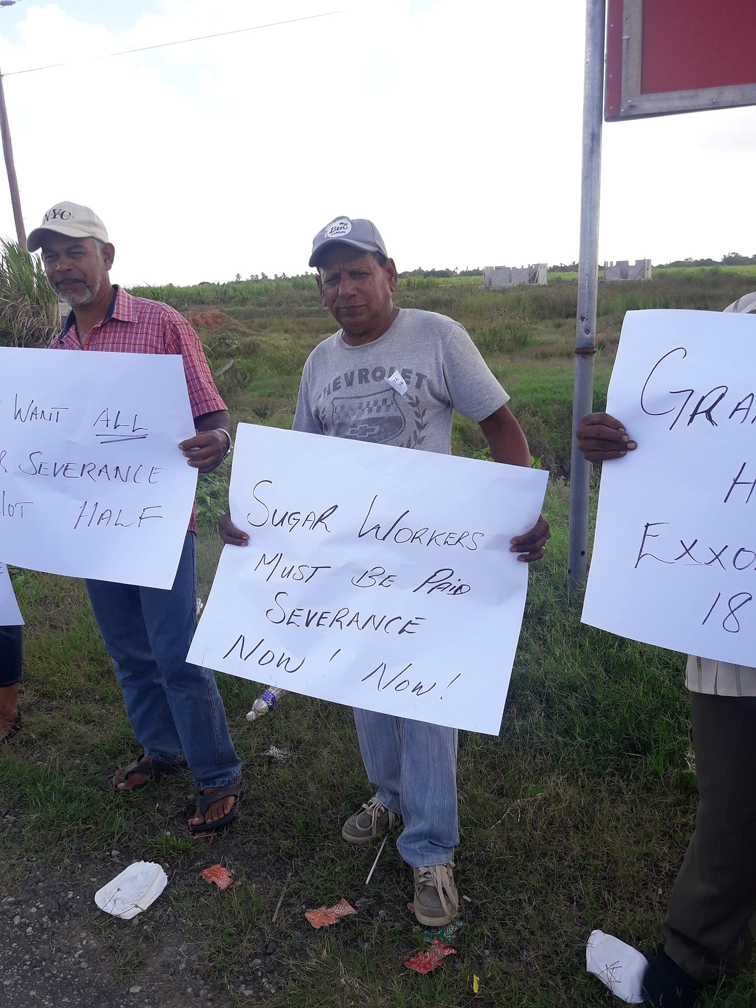 A protestor highlighting the need for full severance payment for laid off sugar workers
