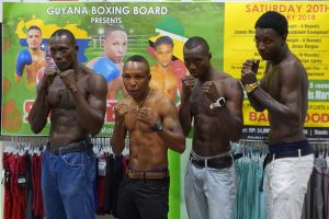 Four The Hard Way! Shawn Corbin, Dexter ‘De Kid Marques, Dexter ‘The Cobra’ Gonsalves and debutant, James Moore pose for a photo following yesterday’s press briefing at the Giftland Mall. (See page 25)