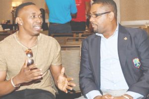 All-rounder Dwayne Bravo (left) chats with CWI president, Dave Cameron, during a players forum in Fort Lauderdale two years ago.
