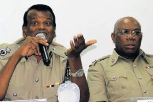 Deputy COP Deodath Dulalchan, left, responds to concerns of residents during a Police Town Meeting at the Valencia South Primary School on Wednesday night. At right is deputy COP Operations (Ag), Mc Donald Jacob.