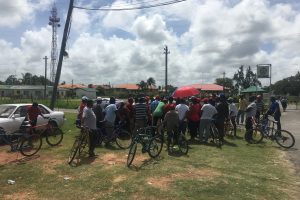 Some of the redundant  workers gathered outside of the East Demerara Estate yesterday morning as the meeting between the former sugar employees and the government, GuySuCo and NICIL officials was ongoing. 