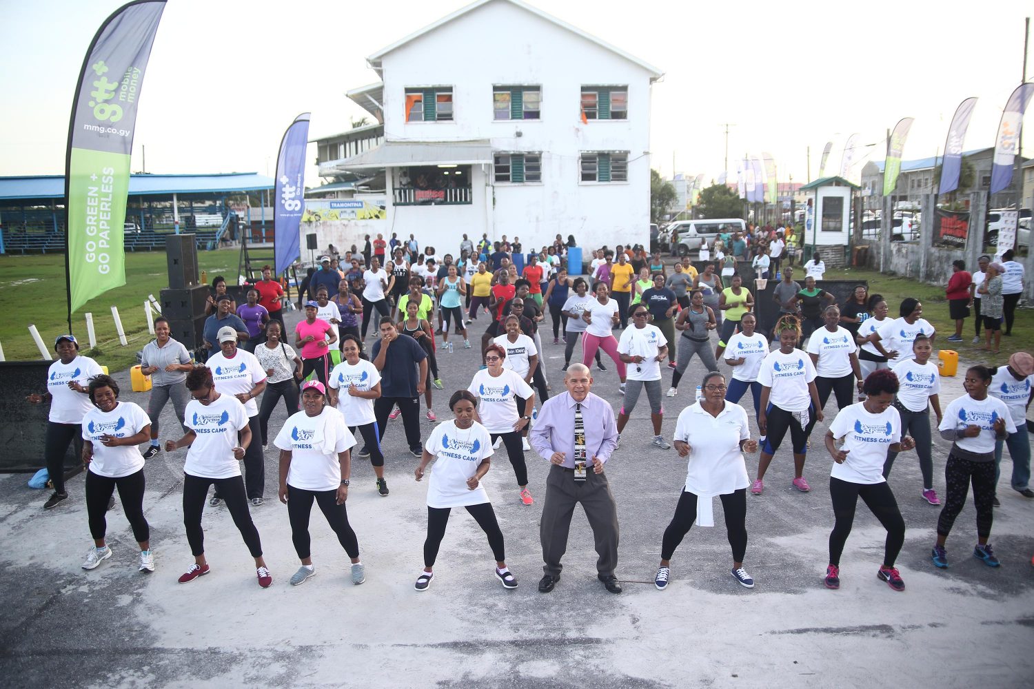 Minister of Social Cohesion, Dr. George Norton (front row centre) participating in an upbeat workout at the launch of the GTT Pulse fitness camp, at the Everest Cricket Ground at Carifesta Avenue and Camp Road yesterday. In this photo participants were actively engaged in a workout challenge in preparation for Mashramani celebrations in February. The free fitness sessions are held every Monday, Wednesday and Friday from 4- 6pm. 