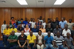 The top brass of the Guyana Olympic Association (GOA) along with some of the stipend awardees pose for a photo yesterday at Olympic House