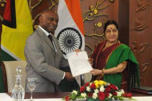 Guyana’s Foreign Minister Carl Greenidge (left) and India’s External Affairs Minister Sushma Swaraj formalising the agreements. (Photo Raveesh Kumar Twitter)