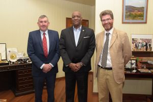 A visitor from the Falklands: Minister of State, Joseph Harmon (centre), on Monday received a courtesy call from Ian Hansen (left), member of the Legislative Assembly of the Falkland Islands at his office at the Ministry of the Presidency. He was accompanied by British High Commissioner to Guyana. Gregory Quinn (right). A release from the Ministry of the Presidency said that among the issues discussed were the Falkland Islands’ fight for self-determination, the Guyana-Venezuela border controversy, the state and future of the Guyana Sugar Corporation and the sugar industry and the emerging oil and gas sector.  (Ministry of the Presidency photo)