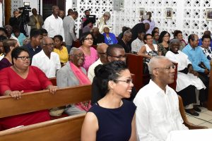 President David Granger (right in foreground), on Sunday evening, joined with the congregation at the St. Mary’s Anglican Church at Soesdyke, East Bank Demerara to ring in the New Year. The Head of State was accompanied by his daughter,  Afuwa Granger. (Ministry of the Presidency photo)