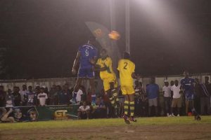 Quincy Holder (left) of GT Police, winning an aerial challenge over two Beacons players during their finals clash in the inaugural GT Beer Berbice 8-aside Football Championship, at the Scott’s School ground, New Amsterdam.