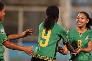 Jamaica’s Olufolasade Adamolekun (centre) is congratulated by teammates following her opening goal. (Photo courtesy CONCACAF Media) 
