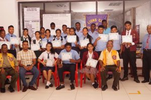 The Lions Club of Central Demerara in conjunction with  Gafsons Industries Limited Toastmasters Club has completed its seventh speech craft training course for students of   East Bank Demerara secondary schools. A release from the club said that twenty-five students from Camille’s Institute Business and Science Studies, Phoenix Elementary School and The institute of Professional Education participated in the five-week  programme which was conducted at the club’s den at Providence.
Seated with the students are:secretary  Lionel Chinian, Gafson Toastmaster president Kaleshwar Basdeo and club president Dwarka Singh.