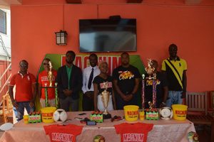 Members of the launch party for the inaugural Magnum Mash Futsal Championship, pose for a photo opportunity at the Windjammer International Hotel and Cuisine, Kitty. Among the launch party are NSC representative Brian Smith (3rd from left), Legacy Entertainment member Esan Griffith (4th from left) and Magnum Brand Coordinator Edison Jefford (3rd from right)