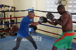 Dexter ‘De Kid’ Marques (left) hits the pad of legendary trainer, Lennox Daniels during a recent workout at the Andrew ‘Sixhead’ Lewis Gym. Marques and Venezuelan, Dionis ‘El Flaco’ Martinez Arias will headline the  five-fight ‘Bad Blood’ card on January 20 at the Cliff Anderson Sports Hall.