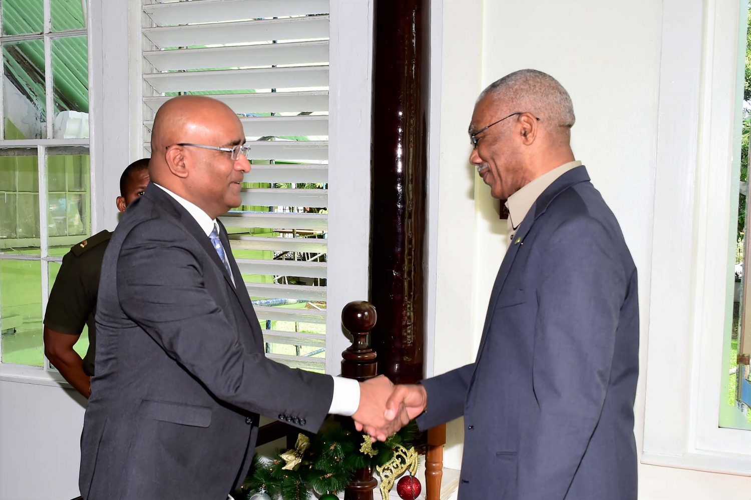President David Granger (right) greeting Opposition leader Bharrat Jagdeo at State House yesterday. (Ministry of the Presidency photo)