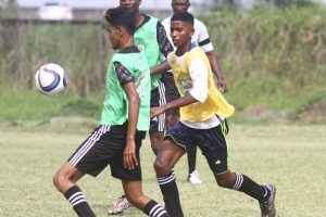Part of the action in the Milo U18 Secondary Schools Football Championship between St. Rose’s High and and Cumming Lodge at the Ministry of Education ground, Carifesta Avenue. (Orlando Charles photo)
