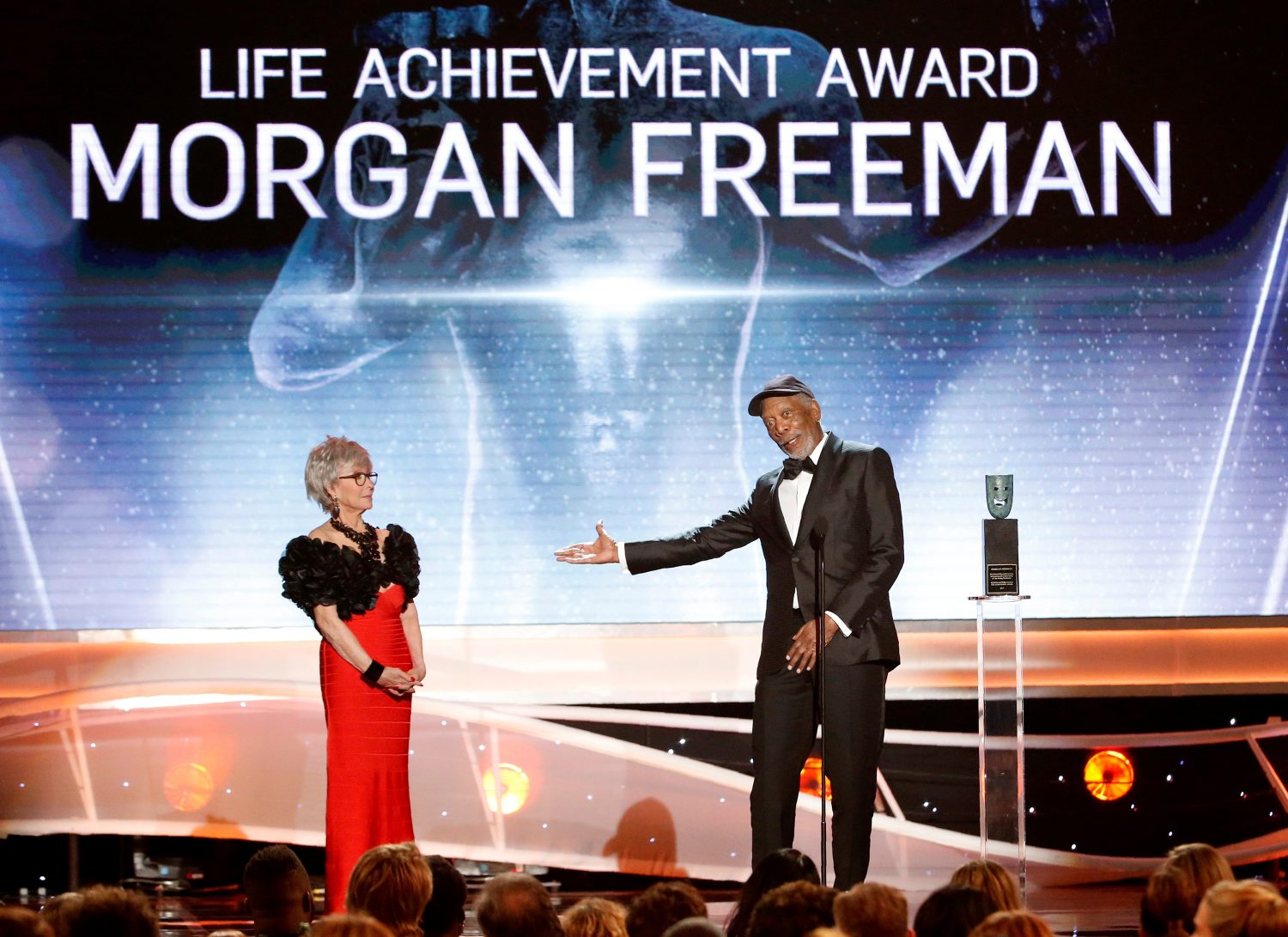 Actor Morgan Freeman accepts the Life Achievement Award from actress Rita Moreno. REUTERS/Mario Anzuoni