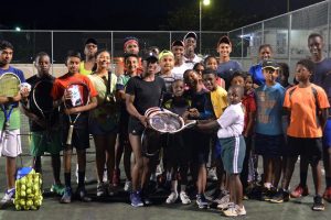 Sachia Vickery giving back to her Guyanese lawn tennis family at the GBTI Lawn Tennis Court in Bel- Air on Friday. (Orlando Charles photo)