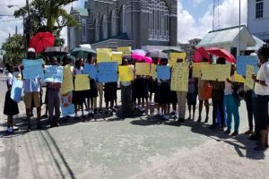 Students, the Board and Members of the PTA in front of the Education Ministry yesterday.