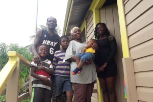 Bertrum Andrews, his wife Kanya Andrews, her daughter Aqueena (at right) and their sons Quintie (centre), Qunces (at left) and baby Qusants at their new home