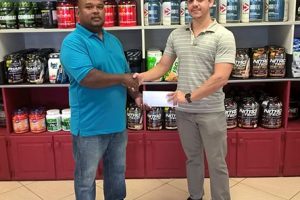Representative of Fitness Express Darren McDonald, recently presented a cheque to Treasurer of the Guyana Amateur Powerlifting Federation (GAPF), Colin Austin to aid in this year’s Novices Powerlifting Championships scheduled for Sunday at the Cliff Anderson Sports Hall.