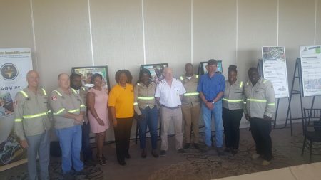 Staff of Guyana Goldfields Inc pose with Chief Executive Officer Scott Caldwell (left) and Country Manager Violet Jean-Baptiste (fifth from left) at the Marriott Hotel.
