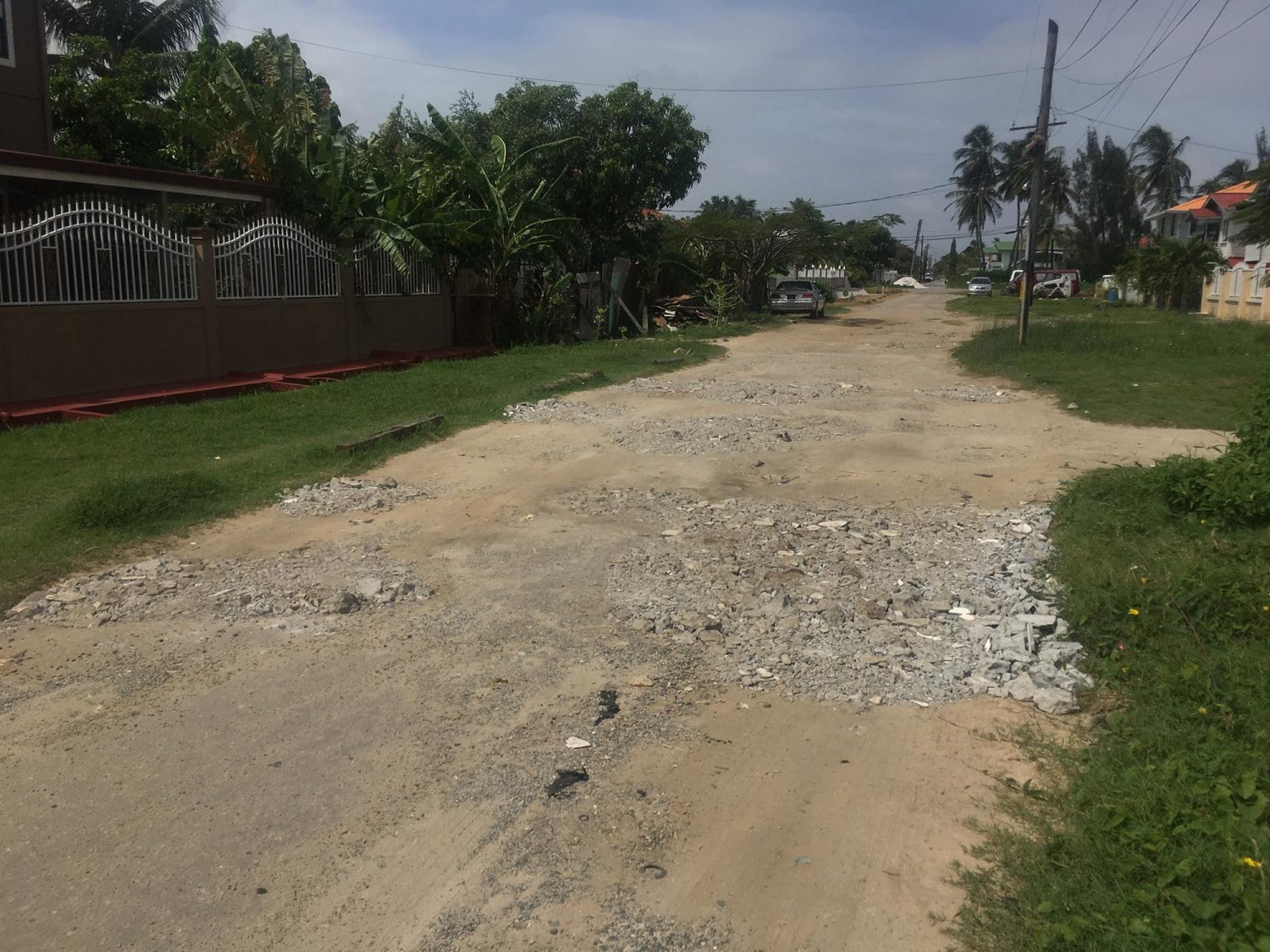 A section of the road in Hugh Ghanie Park in Cummings Lodge, which is riddled with potholes. As a temporary fix, residents filled the holes with construction material. 