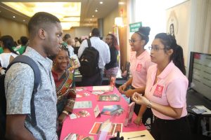 Participants interacting with exhibitors at the Digital Wealth Creation Summit held at the Marriott Hotel on Saturday. 