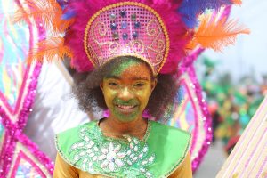 A North Georgetown Primary student leading the school’s ‘Frolic in the Sun’ band during the Children’s Mashramani Costume and Float parade yesterday. See centre pages for more photos. (Photo by Keno George)