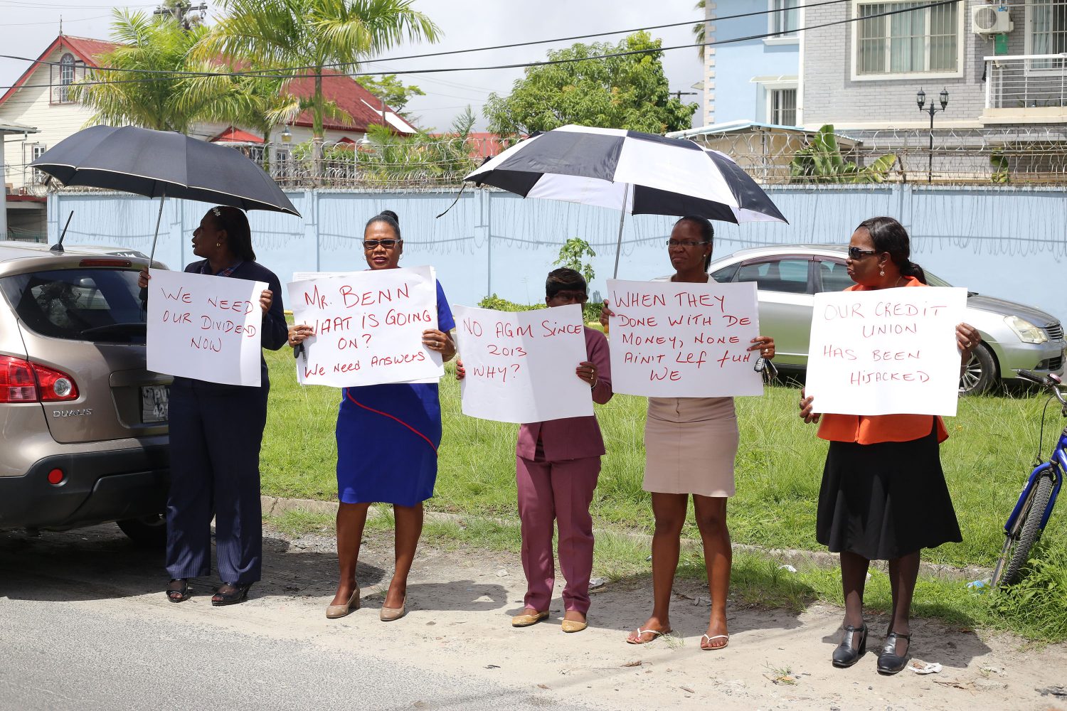 The protestors outside of the Guyana Public Service Cooperative Credit Union yesterday. (Photo by Keno George)