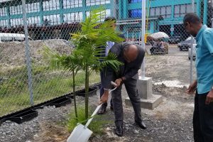 Minister of Natural Resources Raphael Trotman turns the sod at the site designated for construction of the International Petroleum and Maritime Academy at Houston.