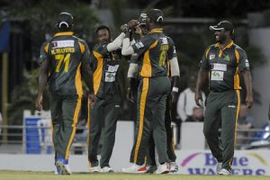 Left-arm spinner Kavem Hodge (second from left), claimed three early wickets for Volcanoes. (file photo) 