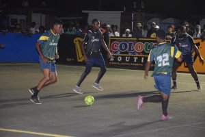 2 vs 2:Trevon Lythcott (left) and Dwayne Lindie (no.22) of ESPN on the attack against Dream Team during their final group fixture at the Pouderoyen Tarmac. 