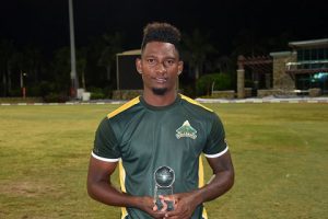 Batsman Roland Cato poses with his Man-of-the-Match trophy following the final. (Photo courtesy CWI Media)