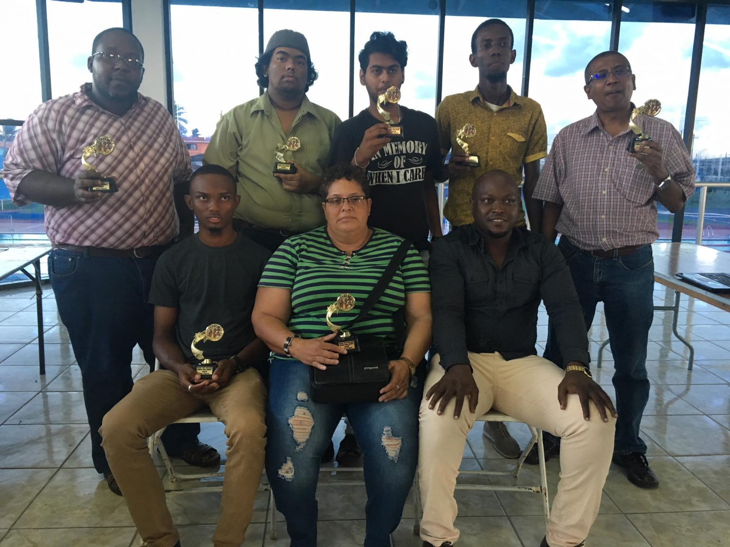 President of the Guyana Chess Federation James Bond (seated, right) with the seven participants who qualified to compete in the Senior National Chess Championship later in the year. The qualifiers will be joined by National Chess Champion Wendell Meusa for the championship. The seven qualifiers are: (standing left to right) Ronuel Greenidge, Taffin Khan Saeed Ali, Glenford Corlette and Loris Nathoo. Seated are: Anthony Drayton and Maria Varona-Thomas. 