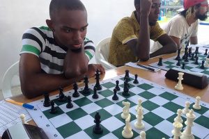 National chess player and FIDE Candidate Master Anthony Drayton (left) leads the National Senior Qualifier Chess Tournament with a perfect score of three points from his three games. Next to Drayton is Glenford Corlette and Rashad Hussein. The tournament continues today from 10 am at the Aquatic Centre, Liliendaal. 