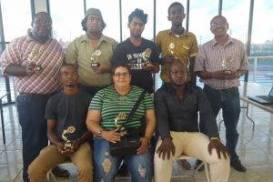 MAGNIFICENT SEVEN! The seven challengers for national champion Wendell Meusa’s crown. From left, standing Ronuel Greenidge, Taffin Khan, Saeed Ali, Glenford Corlette and Loris Nathoo. Sitting, Anthony Drayton, Maria Varona-Thomas and James Bond president of the Guyana Chess Federation.