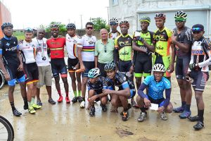  Race Organiser, Hassan Mohamed (center) surrounded by the competitors after the event.(Orlando Charles photo)