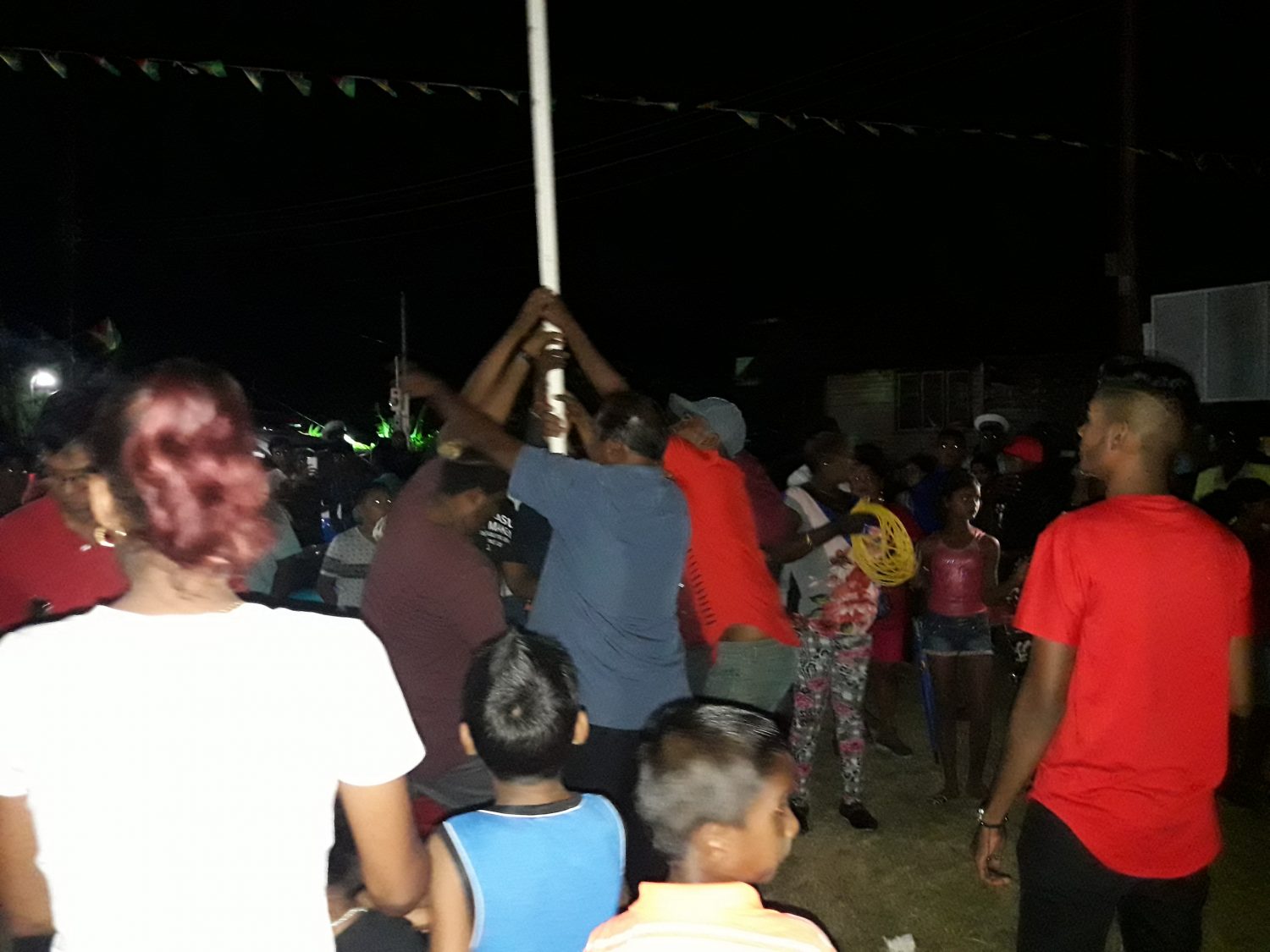 Residents removing the flagpole on Thursday night after the town’s programme had been blocked by the police.
