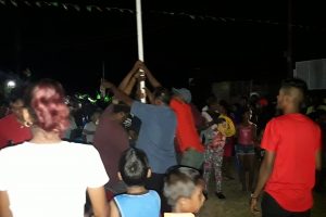Residents removing the flagpole on Thursday night after the town's programme had been blocked by the police.