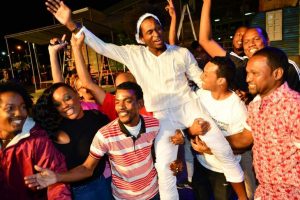 Newly crowned Calypso Monarch Helon Francis celebrates with friends at the Dimanche Gras 2018 at the Grand Stand, Queen's Park Savannah, Port of Spain, early yesterday morning. (Trinidad Express photo)