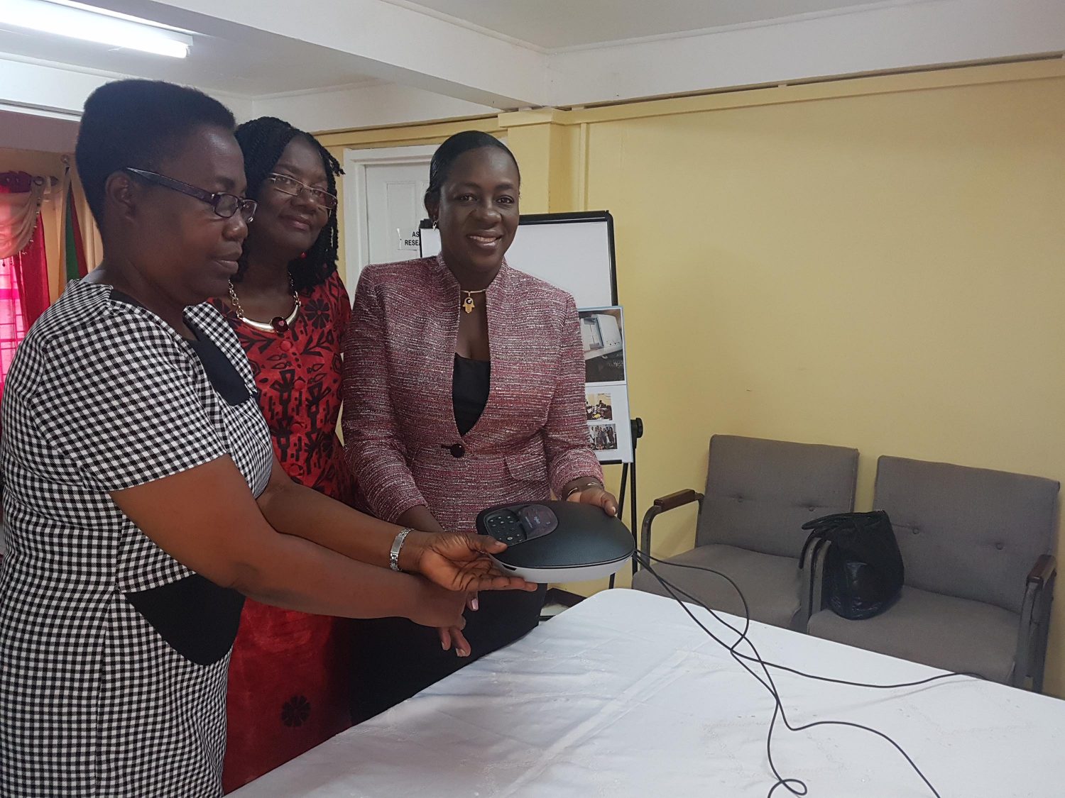 Minister of Education Nicolette Henry (right) with the equipment.  UNESCO Secretary-General to Guyana, Patrice La Fleur is at centre.