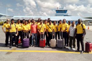 The Guyana Jaguars team is greeted by Guyana Cricket Board Secretary Anand Sanasie (pink shirt) following their arrival at the Eugene F. Correia International Airport yesterday. (Romario Samaroo photo)