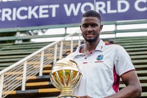 West Indies captain Jason Holder poses with the ICC World Cup qualifying tournament trophy. (Photo courtesy CWI Media) 