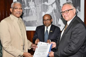 President David Granger (left) receiving the official invitation from Indian High Commissioner, Venkatachalam Mahalingam (centre) and  Ambassador of the French Republic to Guyana, Antoine Joly.  (Ministry of the Presidency photo) 