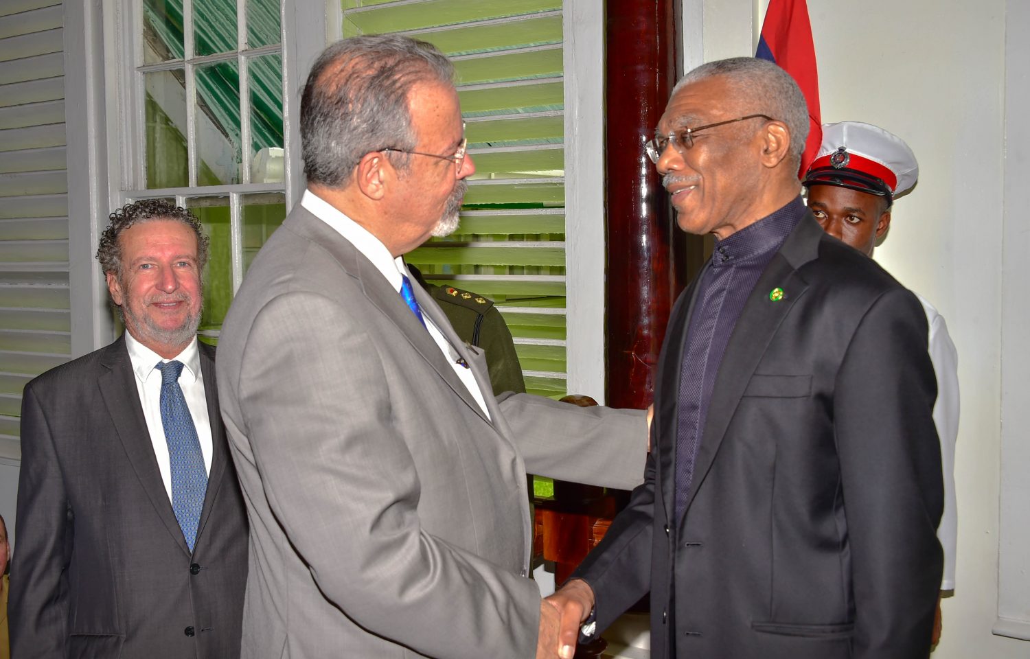 President David Granger (right) greeting Brazil’s Minister of Defence, Raul Jungmann. He later introduced him to members of Cabinet and the Defence Board. (Ministry of the Presidency photo)