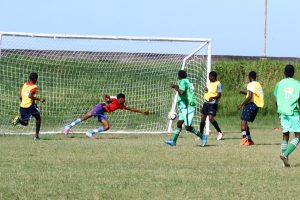 Masters Academy (green) scoring one of their eventual 15 goals against St. George’s High at the Ministry of Education ground, Carifesta Avenue in the Milo Secondary Schools Football Championships. (Orlando Charles photo)