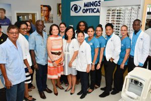 First Lady Sandra Granger and Dr Michelle Ming posing with staff of the Parika branch and others. (Ministry of the Presidency photo)