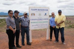 Minister of Natural Resources, Raphael Trotman (right) and Minister of Indigenous Peoples Affairs, Sydney Allicock (third from right) with representatives of JR Ranch Inc. at the dedication site of the reservoir. (DPI photo)