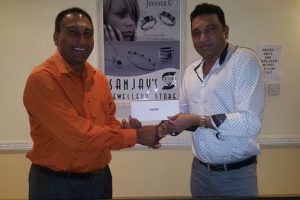 President of the Lusignan Golf Club (LGC) Aleem Hussain accepts the sponsorship cheque from Managing Director of Sanjay’s Jewellery Store, Sheriff Street, Campbellville, Sanjay Persaud, right.