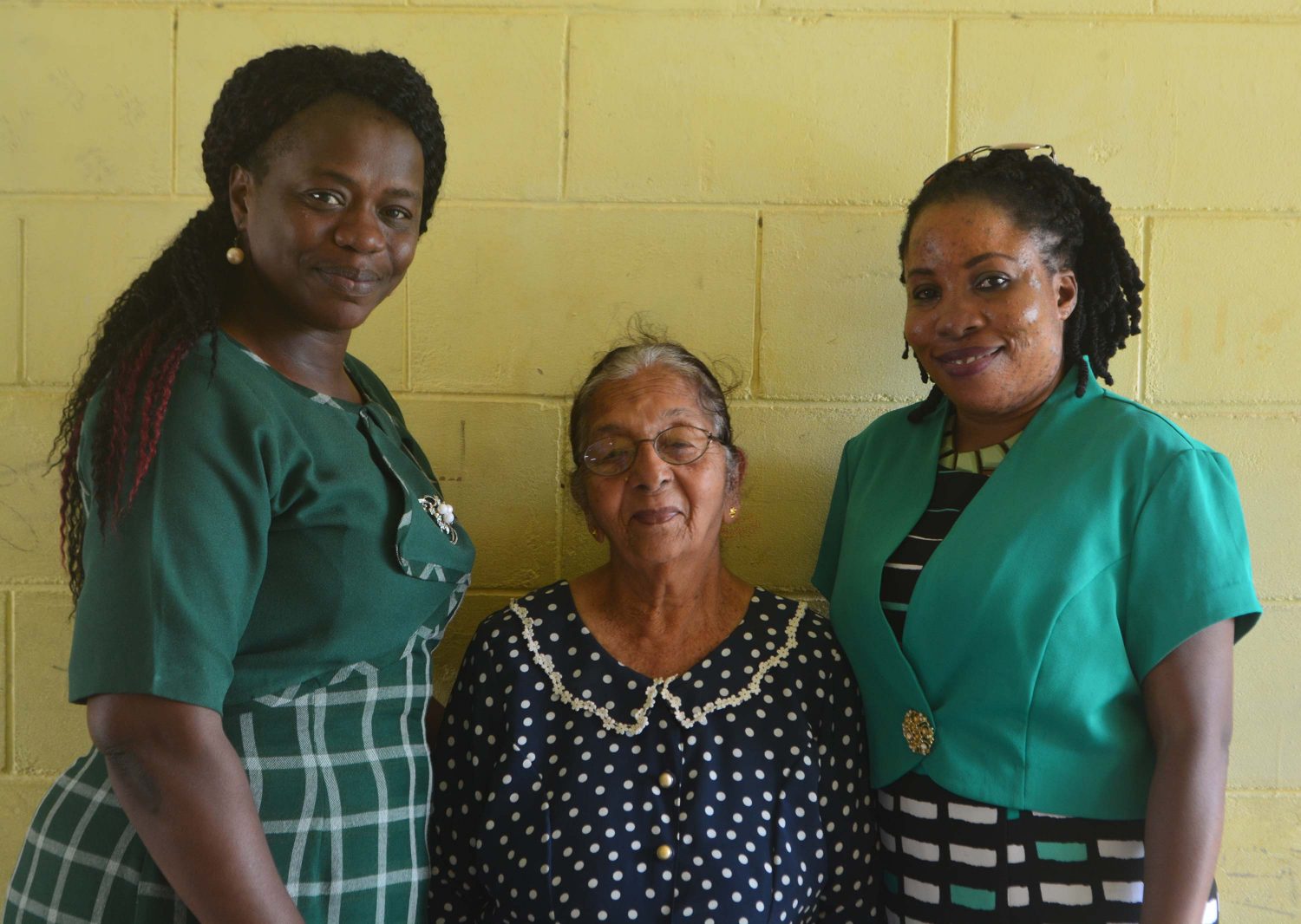 Eighty-one-year-old Sarifari Persaud, a supervisor at Enmore Primary will be celebrating her 46th year as an invigilator, a release from Region Four said yesterday. 
The elderly woman began invigilating in 1972 what was then called the Common Entrance Examinations. 
Over the years, the release said that Persaud has been a fixture at the exams. She said that she enjoys invigilating as it has and continues to give her a great sense of joy and pride.
Meanwhile, Regional Education Officer, Tiffany Favourite-Harvey and Education Officer attached to Region Four, Stembiso Grant hailed the performance and years of service provided by Persaud. The release said that they lauded her contributions in ensuring that the quality and integrity of the exams remained unchallenged over the years. 
Sarifari Persaud (centre) with Tiffany Favourite–Harvey, and Stembiso Grant (Region Four photo)


