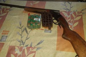 The shotgun and live cartridges found and seized by police.  (Guyana Police Force photo)